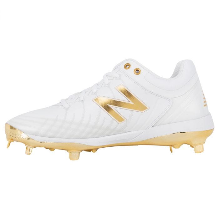 white and gold new balance spikes