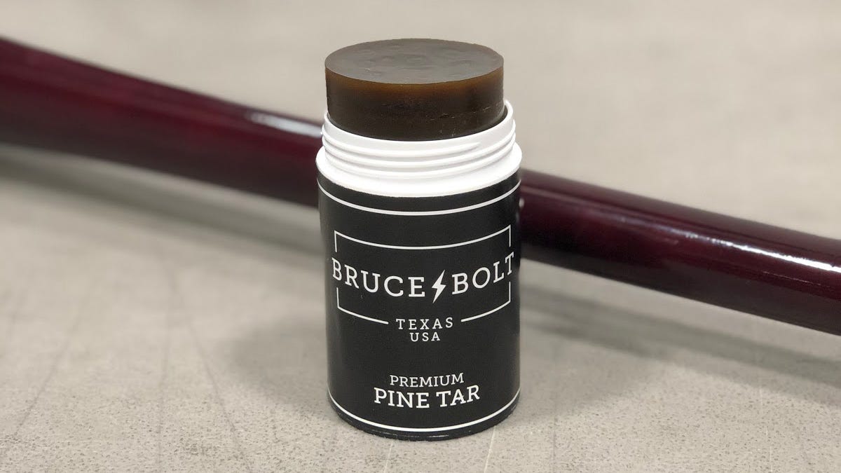 Uncap the stick and expose a few inches of pine tar
